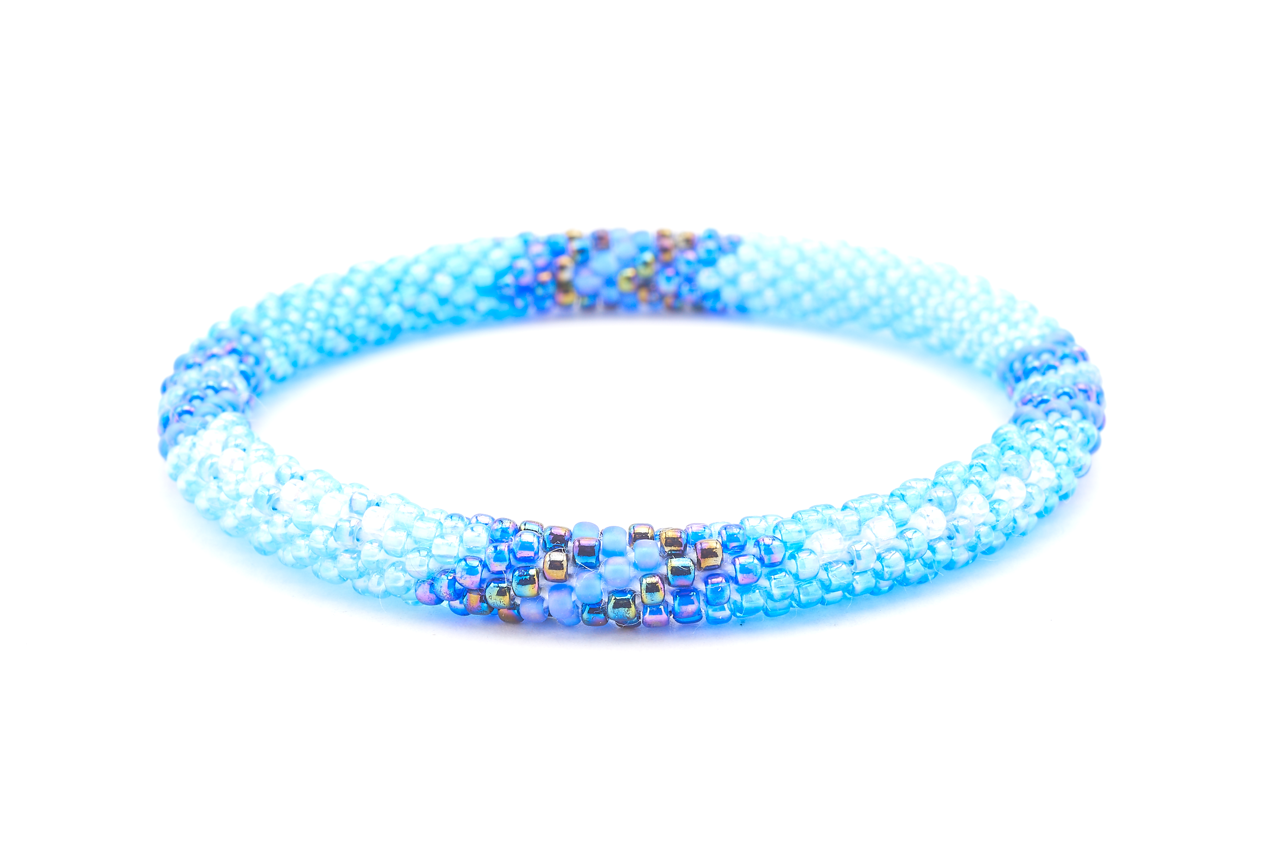 Sashka Co handmade beaded friendship bracelet with iridescent blue, iridescent clear, iridescent, and matte iridescent blue glass beads. Crafted in Nepal by skilled artisans in an arrow pattern.