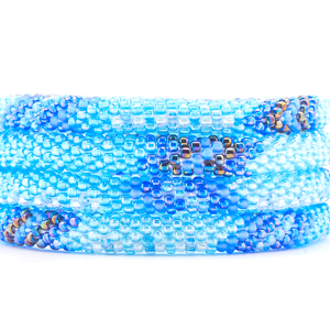 Sashka Co handmade beaded friendship bracelet with iridescent blue, iridescent clear, iridescent, and matte iridescent blue glass beads. Crafted in Nepal by skilled artisans in an arrow pattern.
