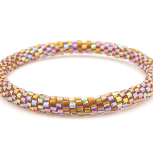 Sashka Co handmade beaded friendship bracelet with iridescent brown glass beads in a unique light-catching shape. Crafted in Nepal by skilled artisans.