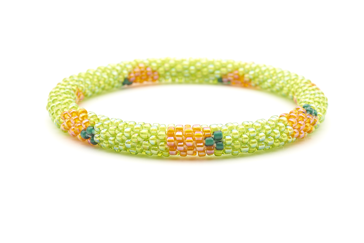 Sashka Co handmade beaded friendship bracelet with iridescent green and orange beads in a pumpkin pattern. Crafted in Nepal by skilled artisans.