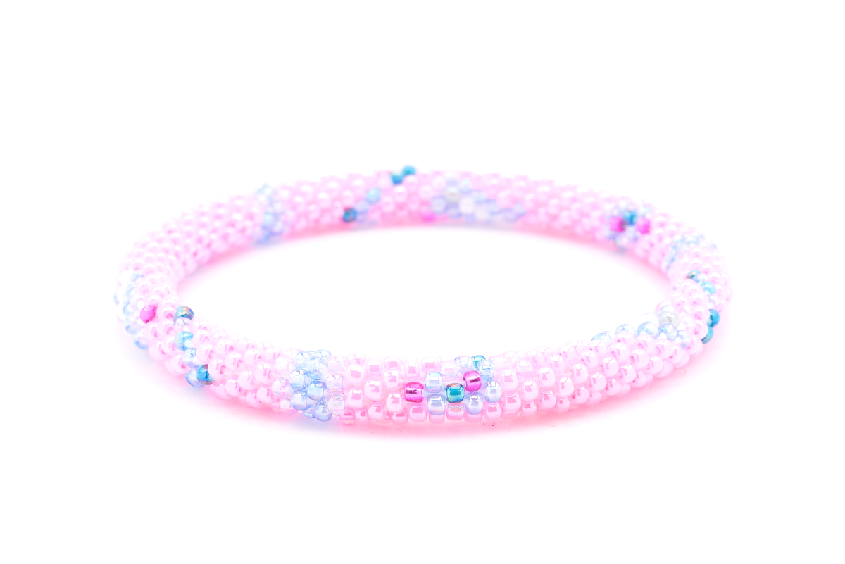 Sashka Co handmade beaded friendship bracelet with pink, lavender, purple, blue, teal, and white glass beads. Crafted in Nepal by skilled artisans in a chevron line pattern.