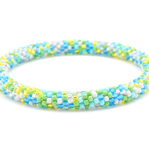 Sashka Co handmade beaded friendship bracelet with matte blue, turquoise, gray, yellow, and iridescent gray glass beads. Crafted in Nepal by skilled artisans in a confetti pattern.