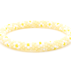 Sashka Co. handmade beaded friendship bracelet with a floral pattern in matte light yellow, white, and yellow. Artisan-crafted in Nepal.