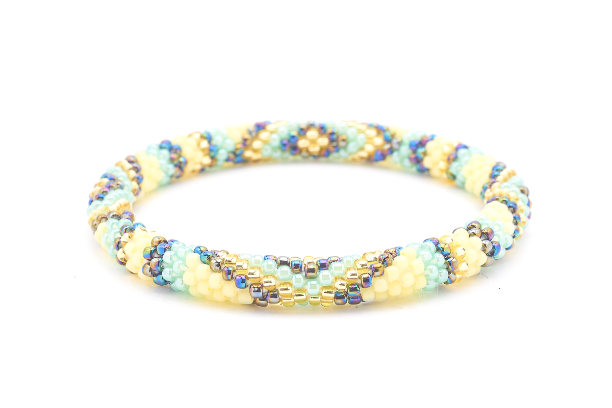 Sashka Co handmade beaded friendship bracelet with matte yellow, champagne gold, iridescent, mint glass beads. Crafted in Nepal by skilled artisans.