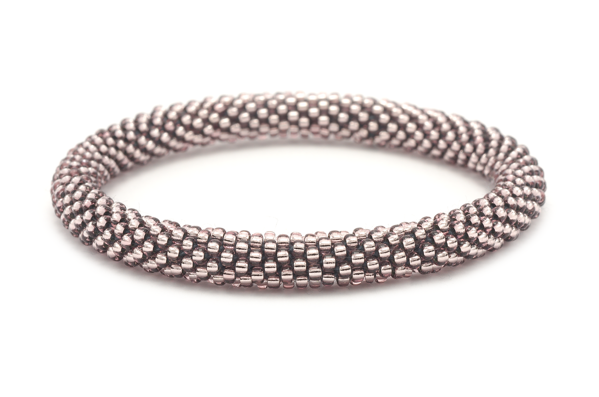 Sashka Co handmade beaded friendship bracelet with metallic purple glass beads. Crafted in Nepal by skilled artisans in a solid pattern.