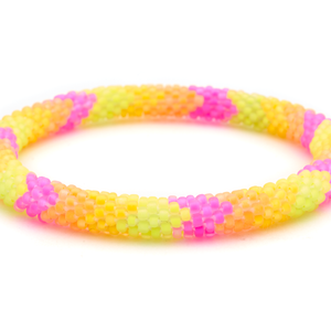 Sashka Co handmade beaded friendship bracelet with neon pink, neon yellow, and neon orange glass beads. Crafted in Nepal by skilled artisans in a chevron pattern.