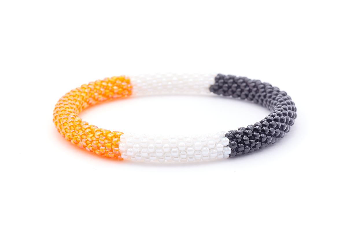 Sashka Co. handmade beaded friendship bracelet with orange, white, and black block pattern. Crafted in Nepal by skilled artisans.