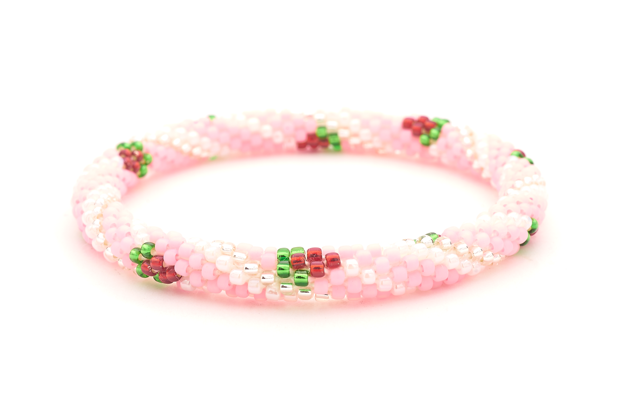 Sashka Co handmade beaded friendship bracelet with pink, clear, white, red, and green strawberry spiral pattern. Crafted in Nepal by skilled artisans.