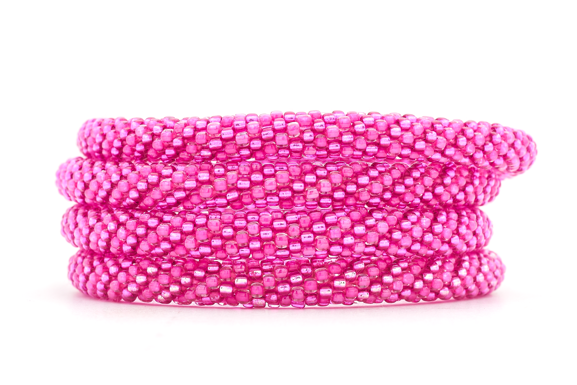Sashka Co handmade beaded friendship bracelet with pink and metallic pink spiral pattern. Crafted in Nepal by skilled artisans.