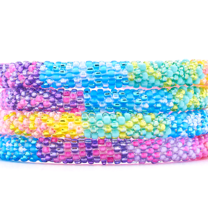 Sashka Co handmade beaded friendship bracelet with pink, purple, matte blue, blue, green, turquoise, yellow, and coral glass beads. Crafted in Nepal by skilled artisans in a confetti block pattern.