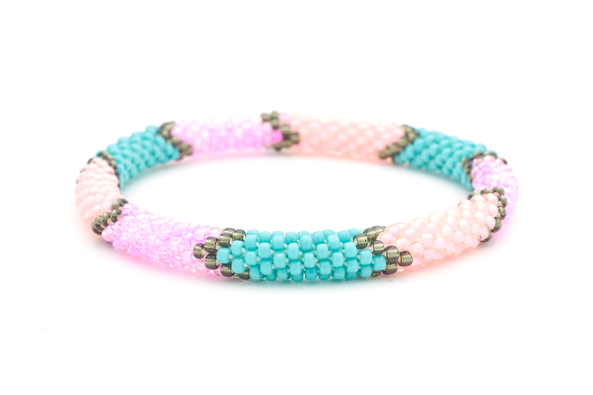 Sashka Co handmade beaded friendship bracelet with pink, turquoise, silver, and coral glass beads. Crafted in Nepal by skilled artisans.
