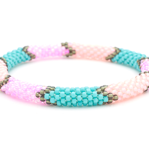 Sashka Co handmade beaded friendship bracelet with pink, turquoise, silver, and coral glass beads. Crafted in Nepal by skilled artisans.