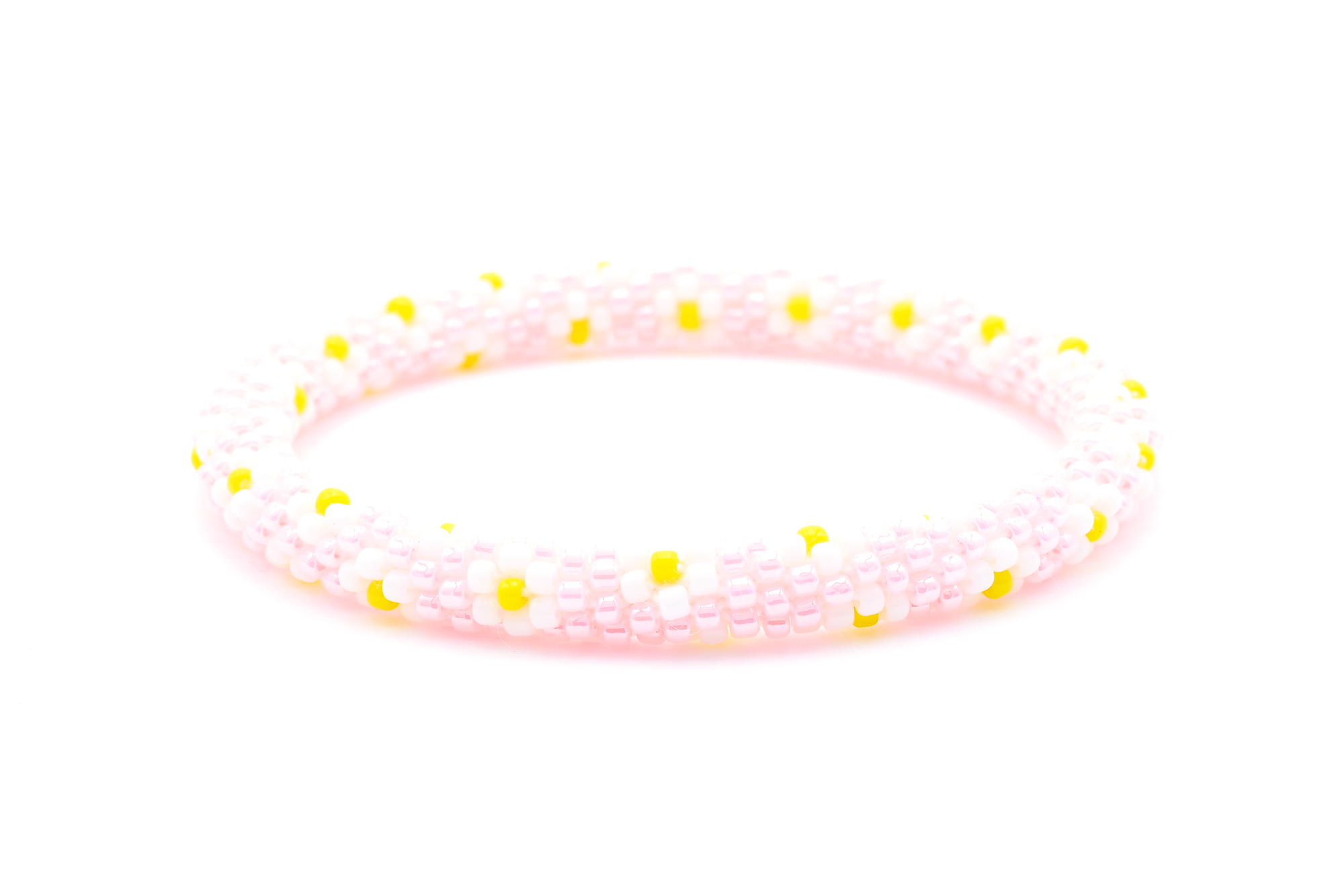 Sashka Co. handmade beaded friendship bracelet with pink, white, and yellow flower pattern. Crafted in Nepal by skilled artisans.