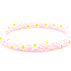 Sashka Co. handmade beaded friendship bracelet with pink, white, and yellow flower pattern. Crafted in Nepal by skilled artisans.