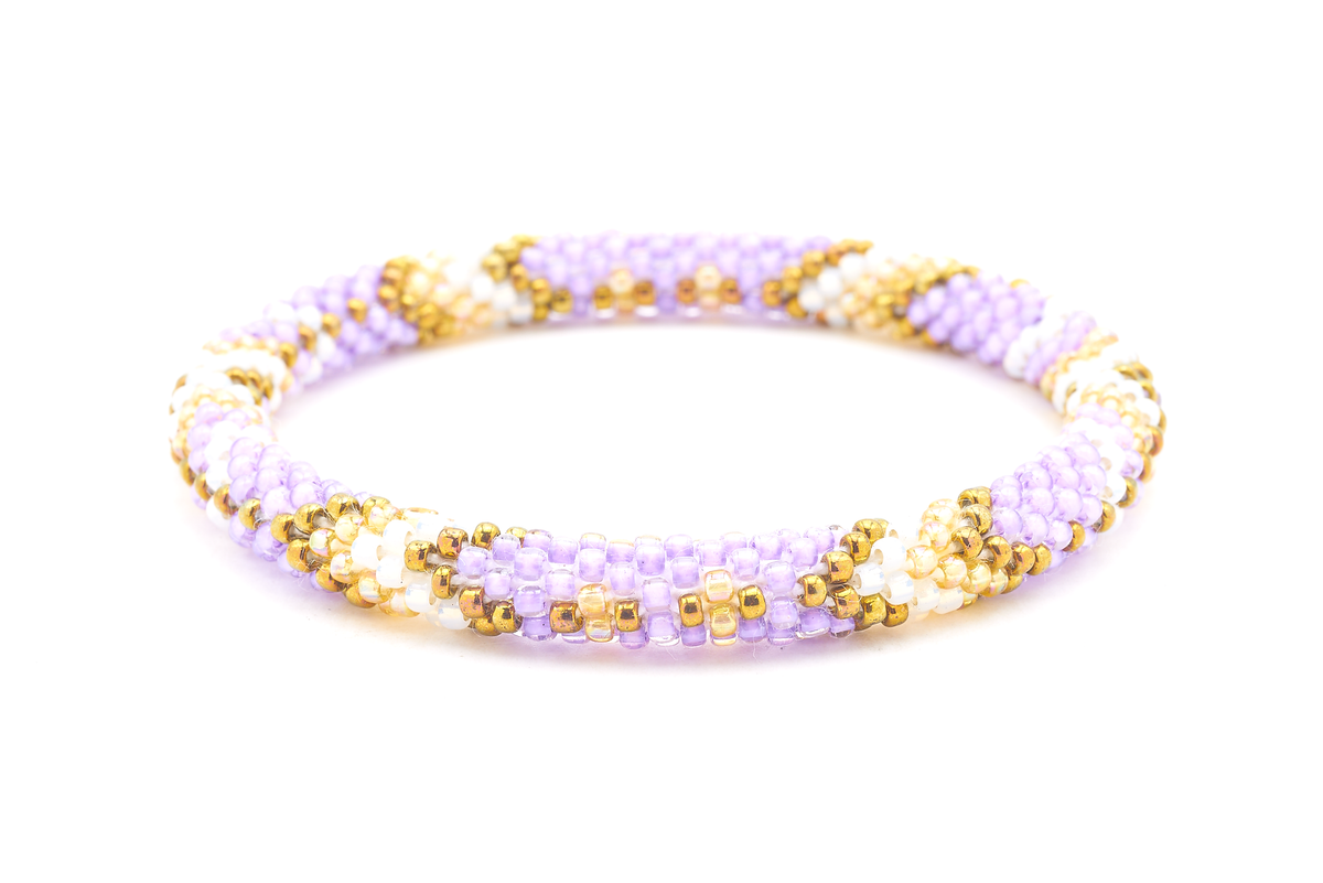 Sashka Co handmade beaded friendship bracelet with purple, bronze, marigold, and white glass beads. Crafted in Nepal by skilled artisans in an arrow diamond pattern.