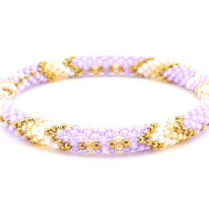 Sashka Co handmade beaded friendship bracelet with purple, bronze, marigold, and white glass beads. Crafted in Nepal by skilled artisans in an arrow diamond pattern.