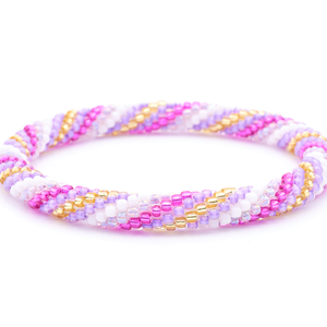 Sashka Co. handmade beaded friendship bracelet with purple, fuchsia, white, champagne gold, and iridescent purple spiral pattern. Crafted in Nepal by skilled artisans.