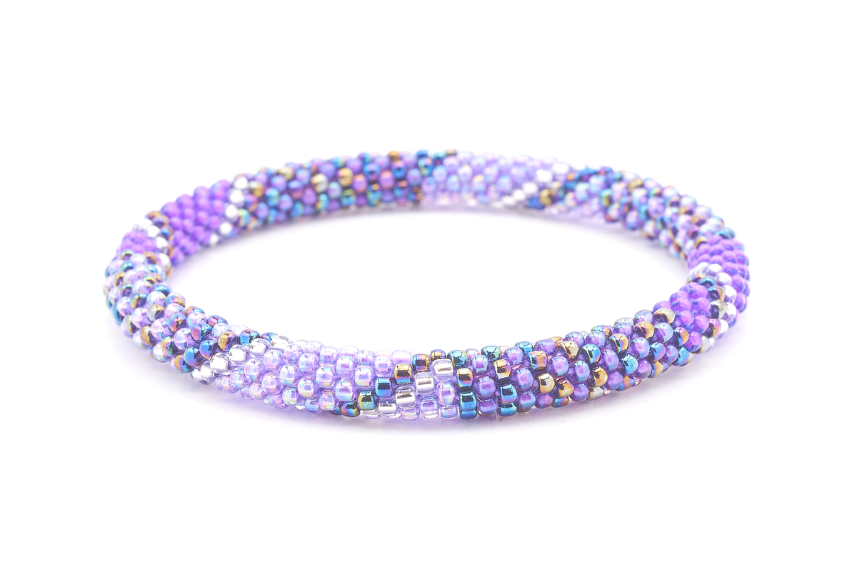 Sashka Co handmade beaded friendship bracelet with purple, iridescent purple, light purple, and clear glass beads. Crafted in Nepal by skilled artisans in a line spiral pattern.