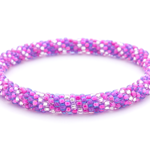 Sashka Co handmade beaded friendship bracelet with purple, pink, and clear glass beads. Crafted in Nepal by skilled artisans in a spiral pattern.

