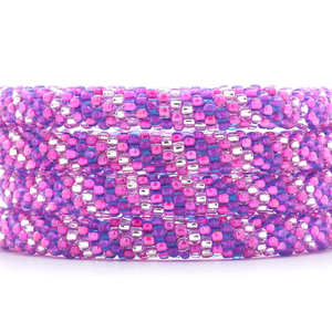 Sashka Co handmade beaded friendship bracelet with purple, pink, and clear glass beads. Crafted in Nepal by skilled artisans in a spiral pattern.

