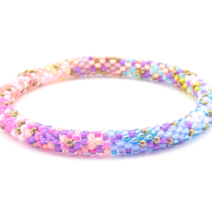 Sashka Co handmade beaded friendship bracelet with purple, pink, red, rose red, aqua, white, blue, bronze, matte periwinkle, matte mauve, matte white, and matte yellow glass beads. Crafted in Nepal by skilled artisans in a confetti mixed pattern.

