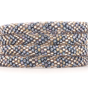 Sashka Co handmade beaded friendship bracelet with silver, clear, and iridescent glass beads in a chevron pattern. Artisan crafted in Nepal.

