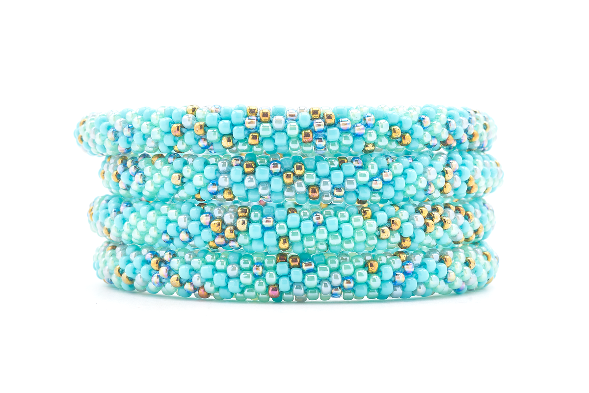 Sashka Co handmade beaded friendship bracelet with turquoise, mint, gray, bronze, and iridescent glass beads. Crafted in Nepal by skilled artisans in a confetti pattern.