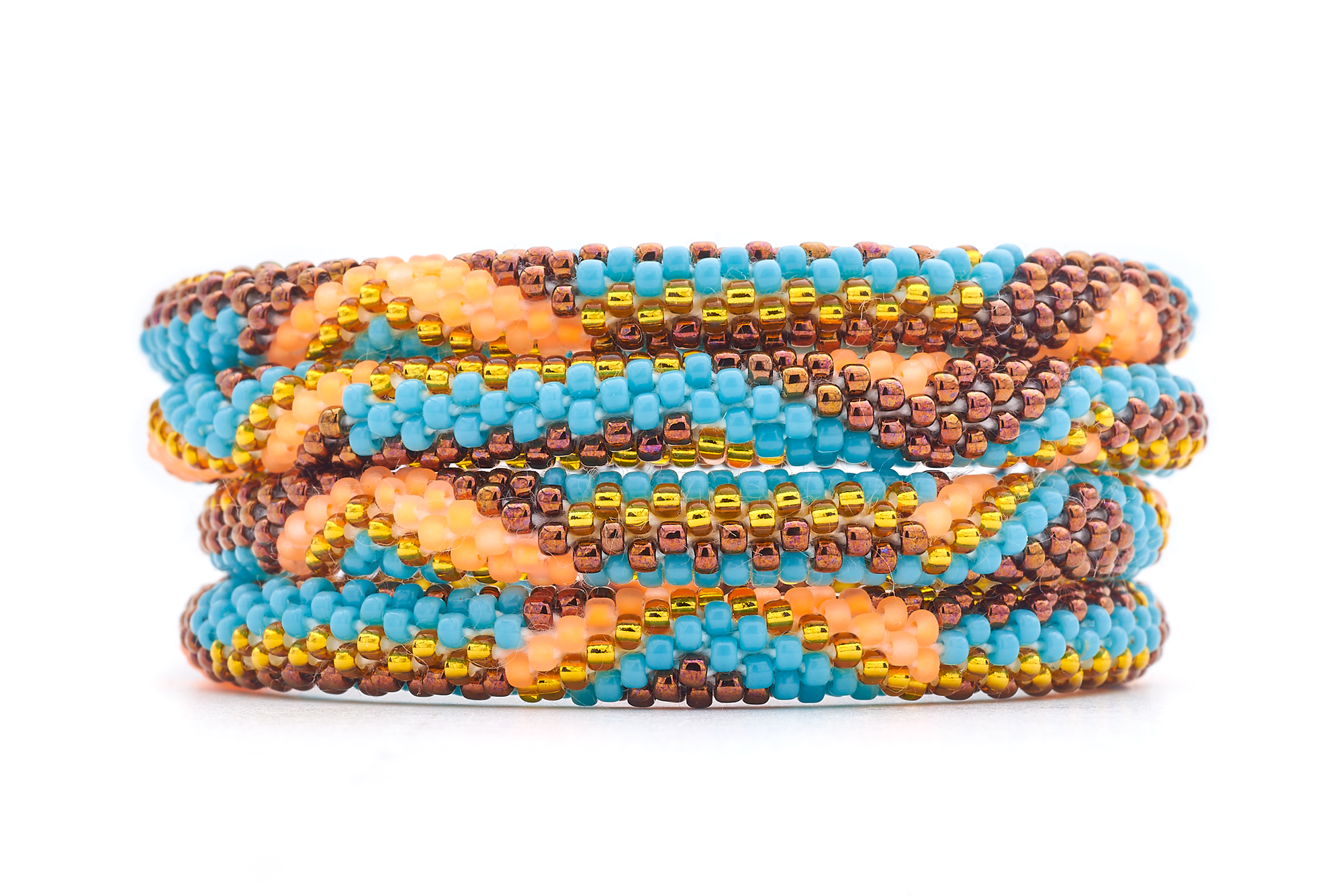 Sashka Co handmade beaded friendship bracelet with turquoise, orange, brown, and gold glass beads. Crafted in Nepal by skilled artisans.