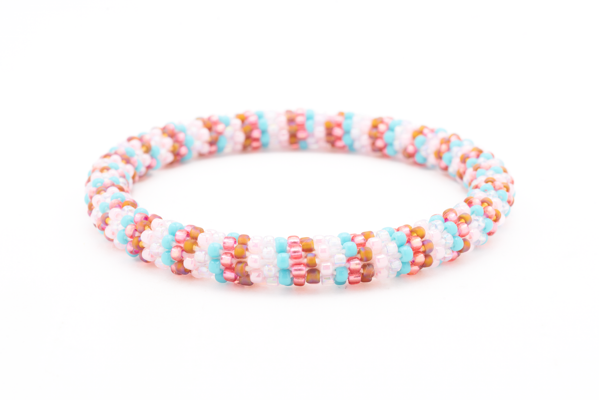 Sashka Co handmade beaded friendship bracelet with turquoise, rose gold, iridescent brown, pink, and white glass beads. Crafted in Nepal by skilled artisans.
 