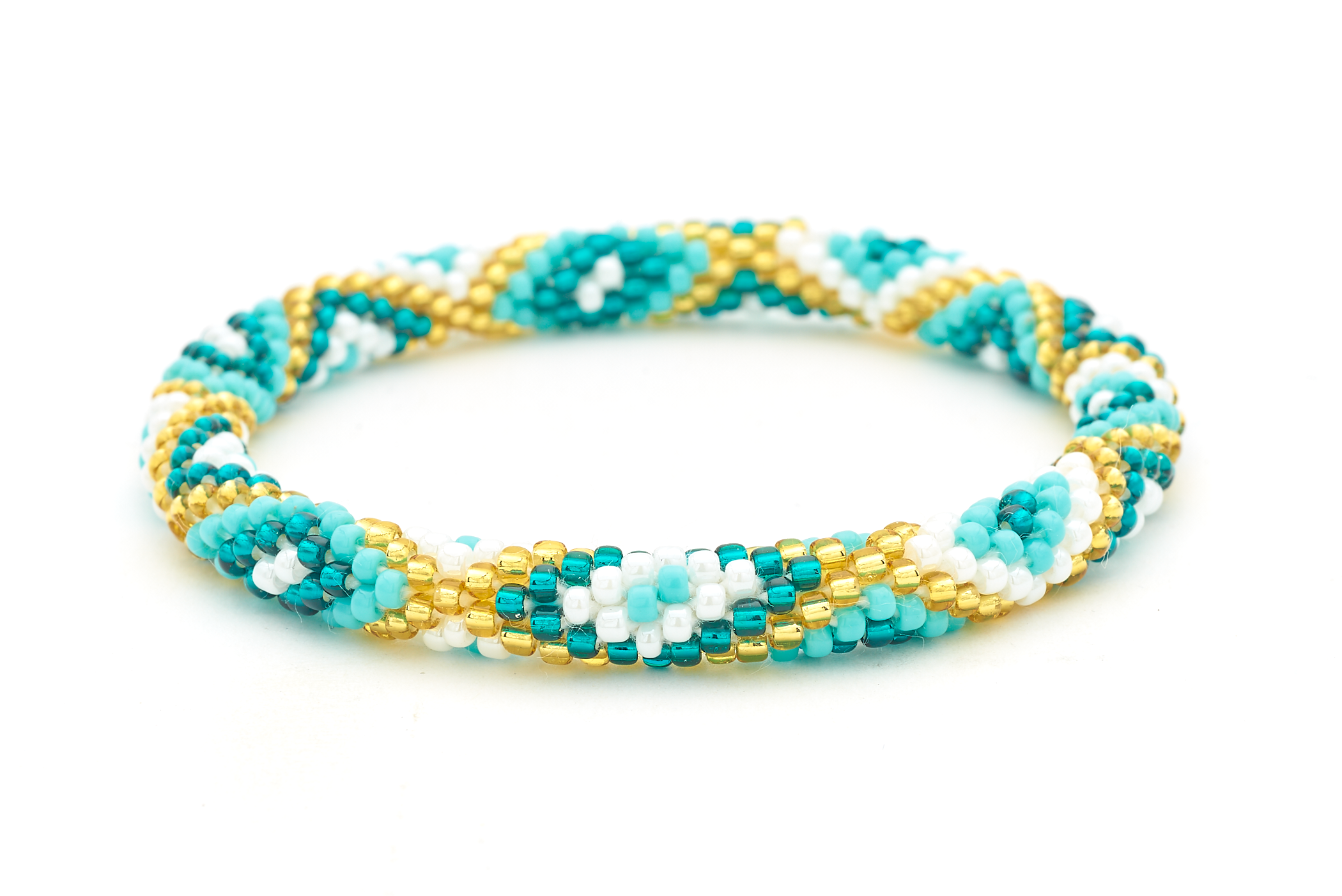 Sashka Co handmade beaded friendship bracelet with turquoise, teal, white, and champagne gold diamond pattern. Crafted in Nepal by skilled artisans.