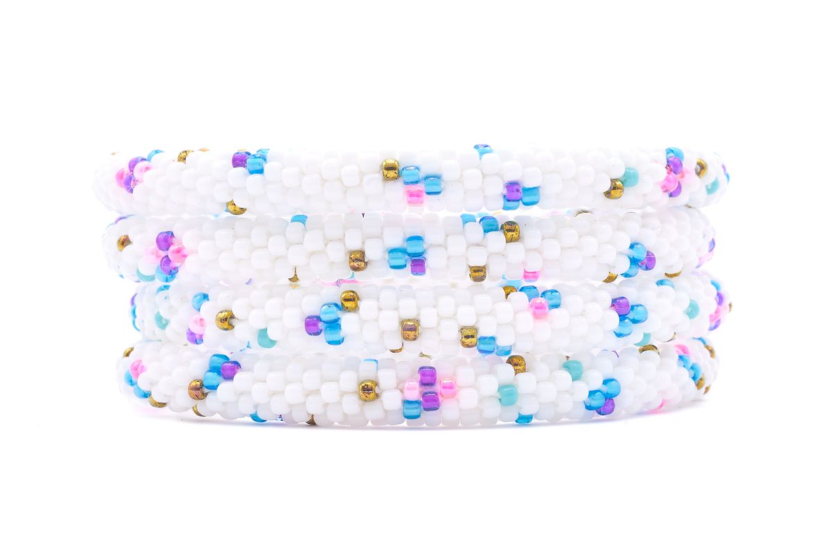 Sashka Co. handmade beaded friendship bracelet with white, blue, pink, purple, and bronze playful pattern. Crafted in Nepal by skilled artisans.