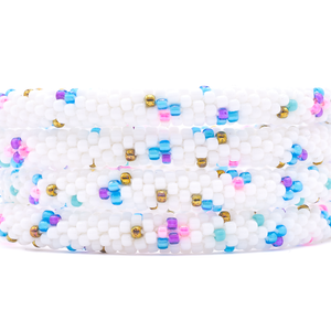 Sashka Co. handmade beaded friendship bracelet with white, blue, pink, purple, and bronze playful pattern. Crafted in Nepal by skilled artisans.