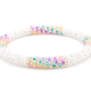 Sashka Co handmade beaded friendship bracelet with a line pattern in white, clear, rose gold, purple, blue, green, yellow, and coral. Crafted in Nepal by skilled artisans.