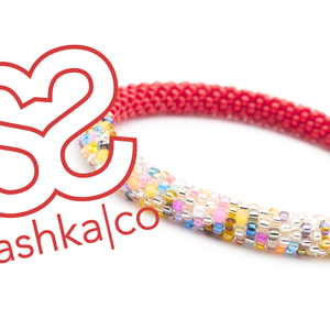 Sashka Co. handmade glass beaded friendship bracelet with red and a colorful mix of glass beads. Crafted in Nepal by skilled artisans.