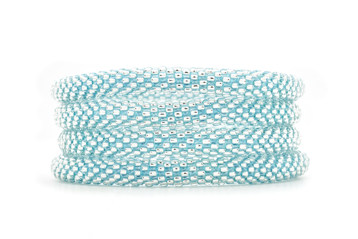 Handmade glass bead Clear with Blue Thread bracelet from Nepal, featuring a roll design. Also known as a beaded bracelet, seed bead bracelet, beach glass bracelet, or sea glass bracelet