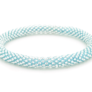 Handmade glass bead Clear with Blue Thread bracelet from Nepal, featuring a roll design. Also known as a beaded bracelet, seed bead bracelet, beach glass bracelet, or sea glass bracelet