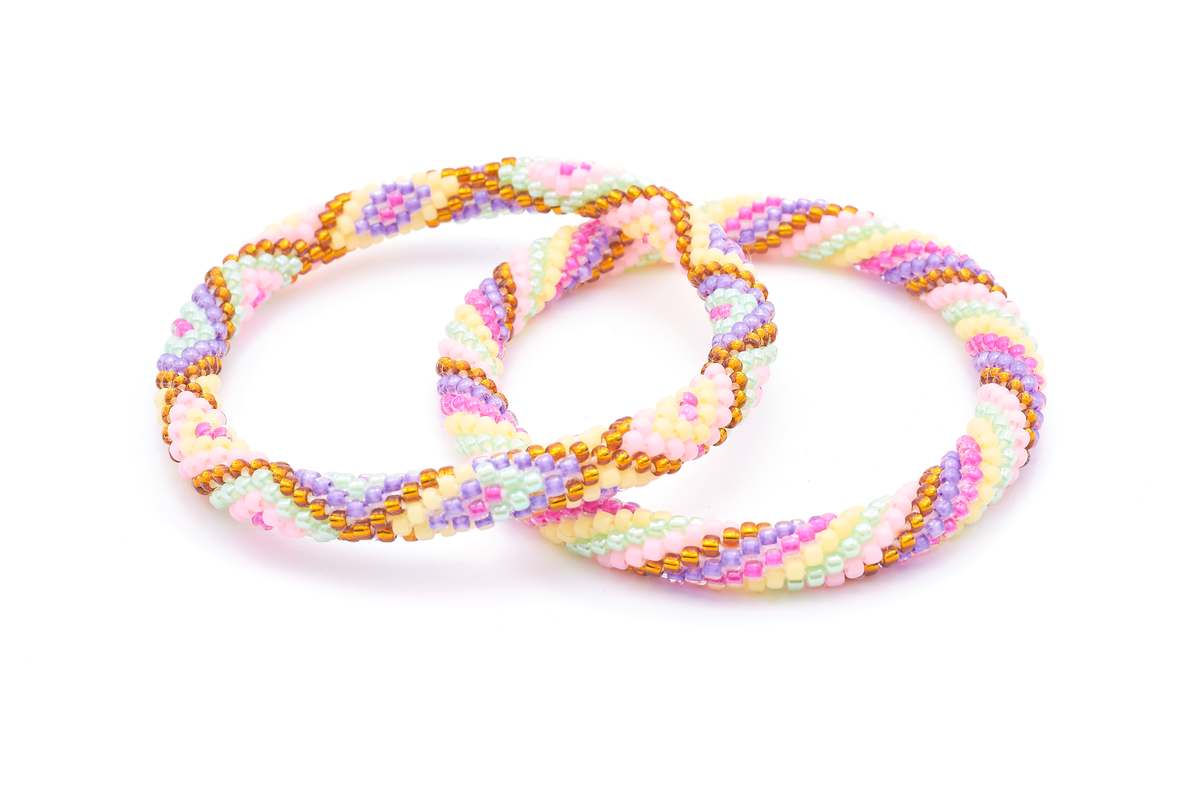 Sashka Co. handmade beaded friendship bracelet with gold, purple, pink, matte yellow, mint, and matte pink glass beads. Crafted in Nepal by skilled artisans.