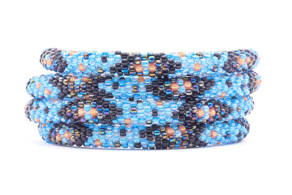 Sashka Co. handmade beaded friendship bracelet with blue, black, orange, and iridescent chevron polka dot pattern. Crafted in Nepal by skilled artisans.