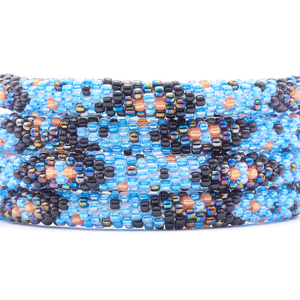 Sashka Co. handmade beaded friendship bracelet with blue, black, orange, and iridescent chevron polka dot pattern. Crafted in Nepal by skilled artisans.