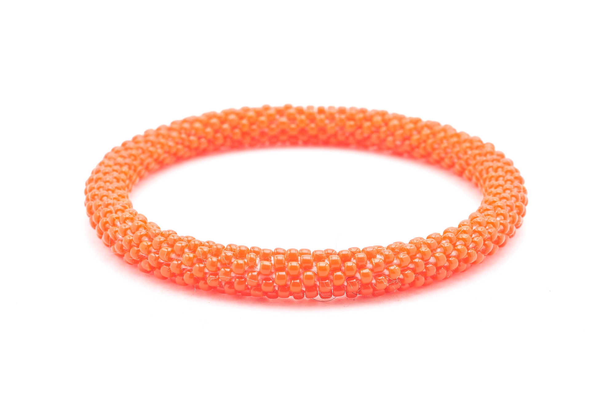 Sashka Co handmade beaded friendship bracelet with red orange glass beads. Crafted in Nepal by skilled artisans in a solid pattern.


