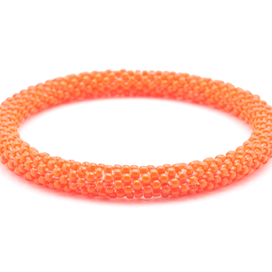 Sashka Co handmade beaded friendship bracelet with red orange glass beads. Crafted in Nepal by skilled artisans in a solid pattern.

