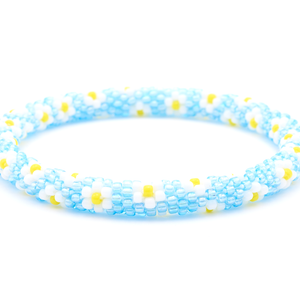 Sashka Co. handmade beaded friendship bracelet with blue, white, and yellow flower pattern. Crafted in Nepal by skilled artisans.