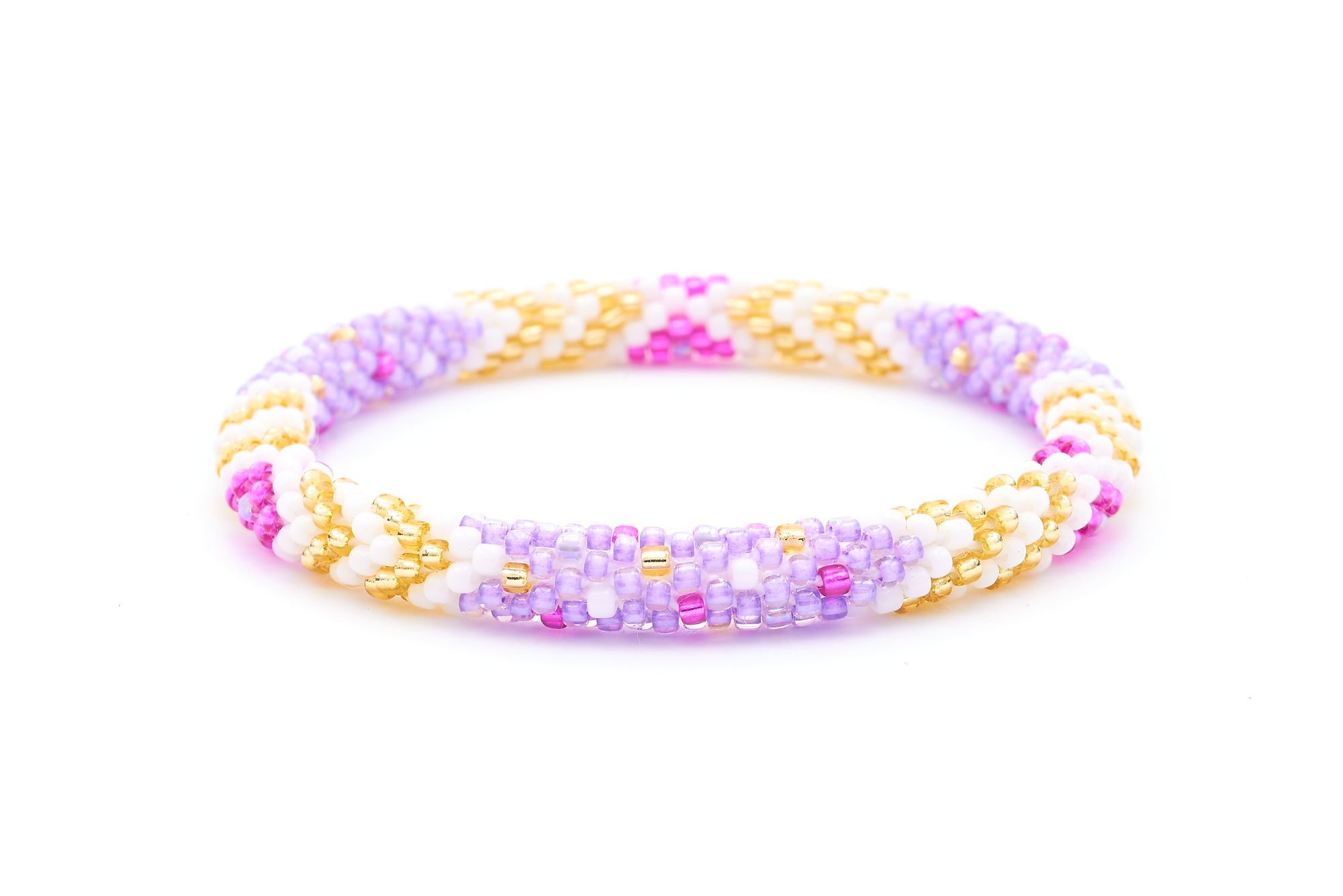 Sashka Co. handmade beaded friendship bracelet with purple, white, champagne gold, and fuchsia glass beads. Crafted in Nepal by skilled artisans in a chevron polka dots pattern.
