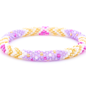 Sashka Co. handmade beaded friendship bracelet with purple, white, champagne gold, and fuchsia glass beads. Crafted in Nepal by skilled artisans in a chevron polka dots pattern.