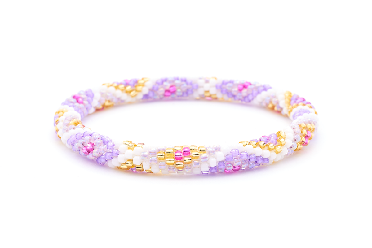 Sashka Co. handmade beaded friendship bracelet with iridescent purple, purple, fuchsia, champagne gold, and white glass beads. Crafted in Nepal by skilled artisans in a diamond pattern.
