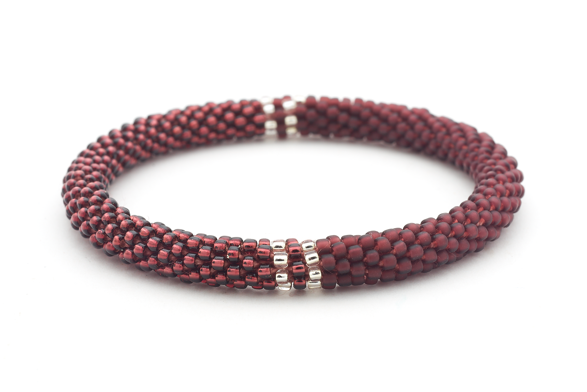Handmade glass bead deep purple and clear bracelet from Nepal, featuring a roll design. Also known as a beaded bracelet, seed bead bracelet, beach glass bracelet, or sea glass bracelet
