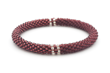 Handmade glass bead deep purple and clear bracelet from Nepal, featuring a roll design. Also known as a beaded bracelet, seed bead bracelet, beach glass bracelet, or sea glass bracelet