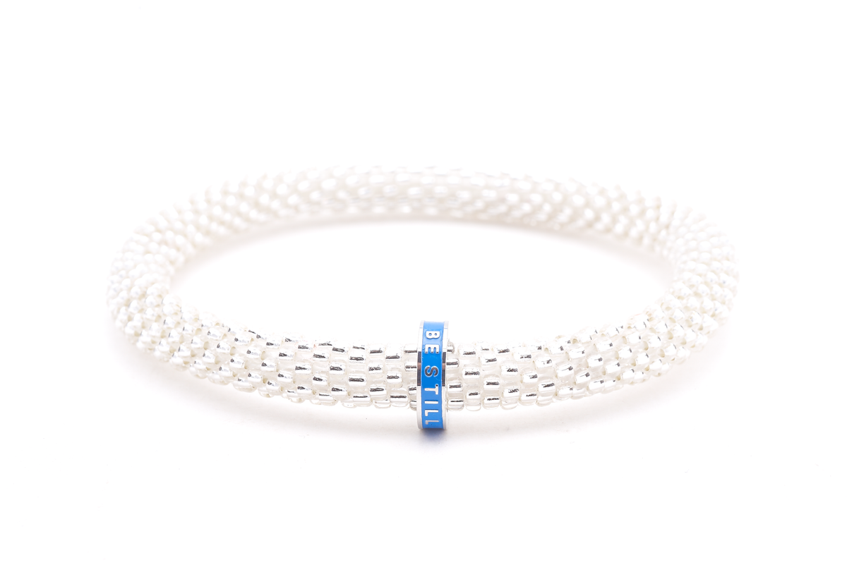 Handmade clear glass beaded friendship charm bracelets from Nepal. Empowering women in need through fair trade.