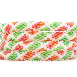 Sashka Co. handmade glass beaded friendship bracelet with red, white, and green glass beads. Crafted in Nepal by skilled artisans.