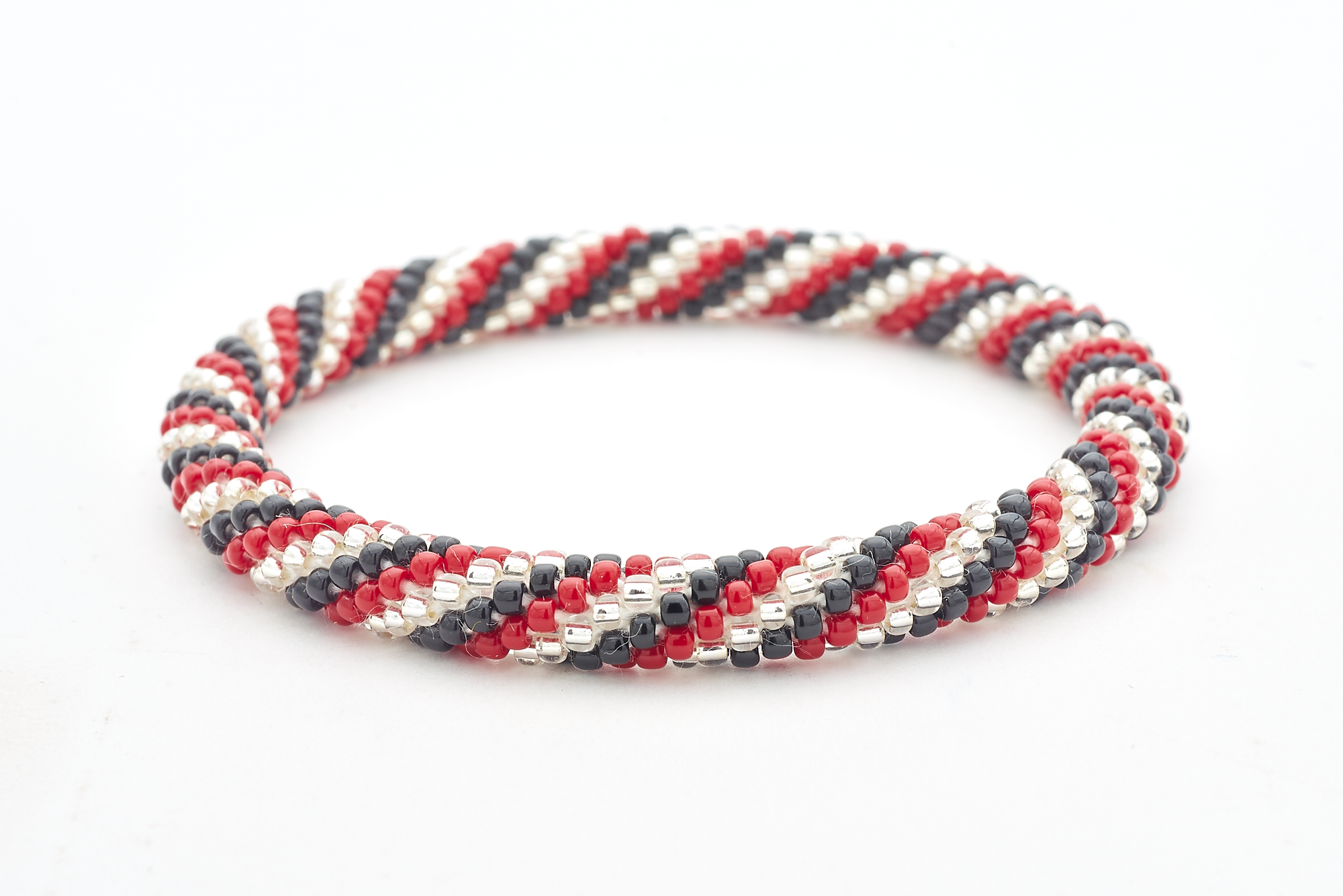Handmade glass bead bracelet from Nepal, featuring a roll design. Also known as a beaded bracelet, seed bead bracelet, beach glass bracelet, or sea glass bracelet